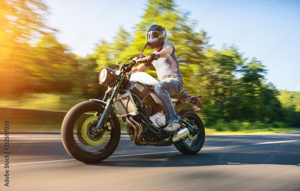 Obraz premium motorbike on the road riding. having fun riding the empty road on a motorcycle tour / journey