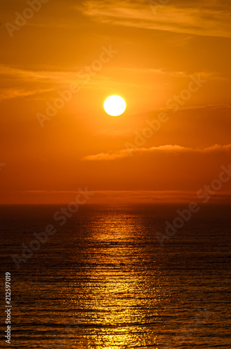 Beach of Black Sea from Mamaia, Romania with golden orange sky, sands and blue clear water, sunrise
