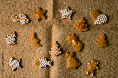 Various gingerbread shapes on natural brown cloth