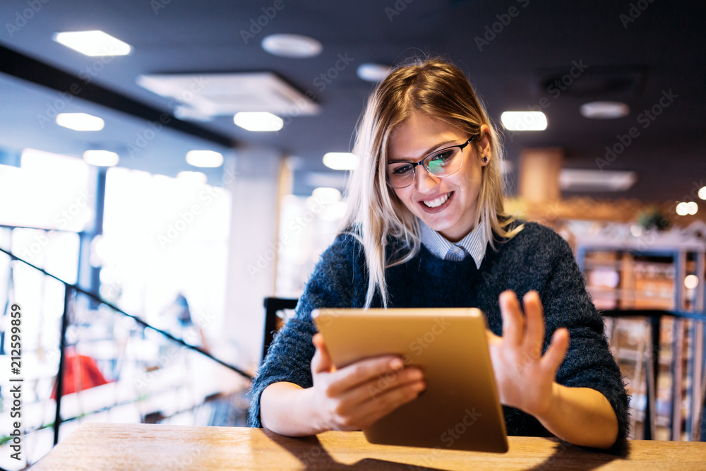 Portrait of young attractive woman using tablet Portrait of young attractive woman using tablet