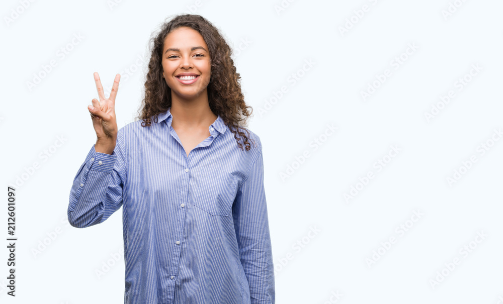 Young hispanic business woman showing and pointing up with fingers number two while smiling confident and happy. Young hispanic business woman showing and pointing up with fingers number two while smiling confident and happy.
