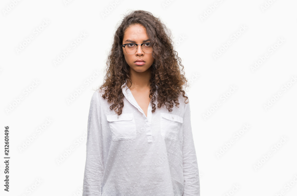Beautiful young hispanic woman skeptic and nervous, frowning upset because of problem. Negative person. Beautiful young hispanic woman skeptic and nervous, frowning upset because of problem. Negative person.