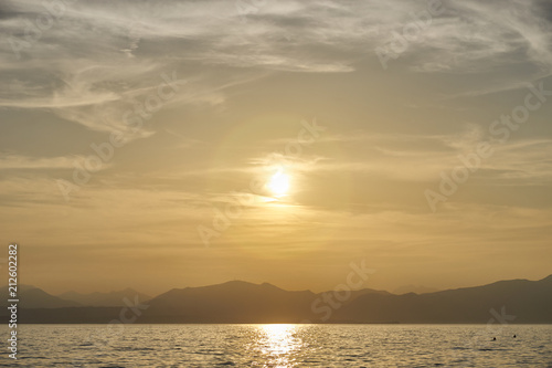 Spectacular sunset with beautiful light at City of Bardolino / Lake Garda in Italy © marako85