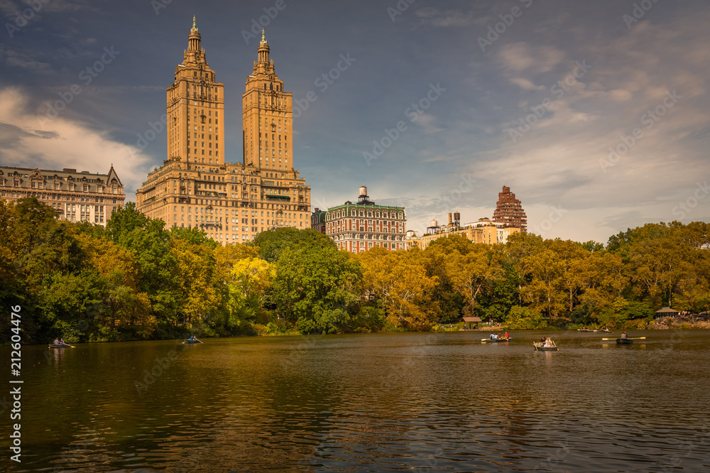 Central Park Lake. New York City, USA at the Central Park Lake and Upper West Side skyline in the Autumn.