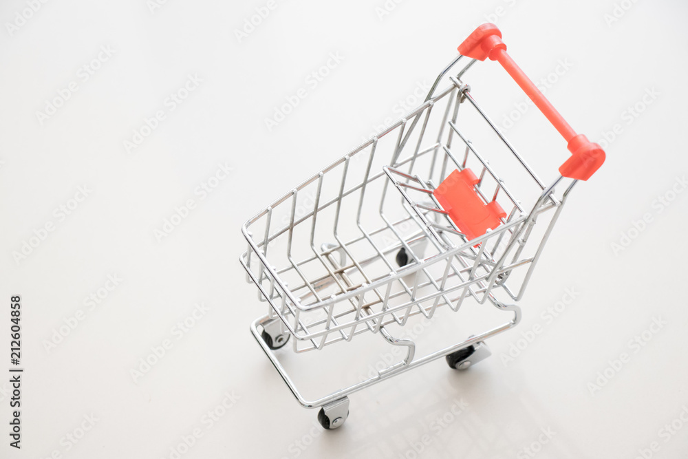 Shopping cart on white background with copy space Shopping cart on white background with copy space