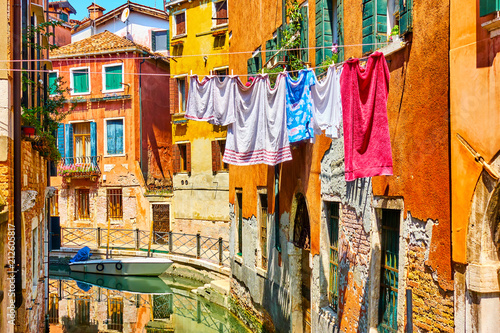 Colorful old houses by canal in Venice © Roman Sigaev