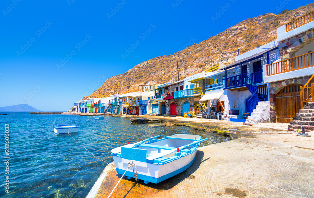Scenic Klima village (traditional Greek village by the sea, the Cycladic-style) with sirmata - traditional fishermen's houses, Milos island, Cyclades, Greece.