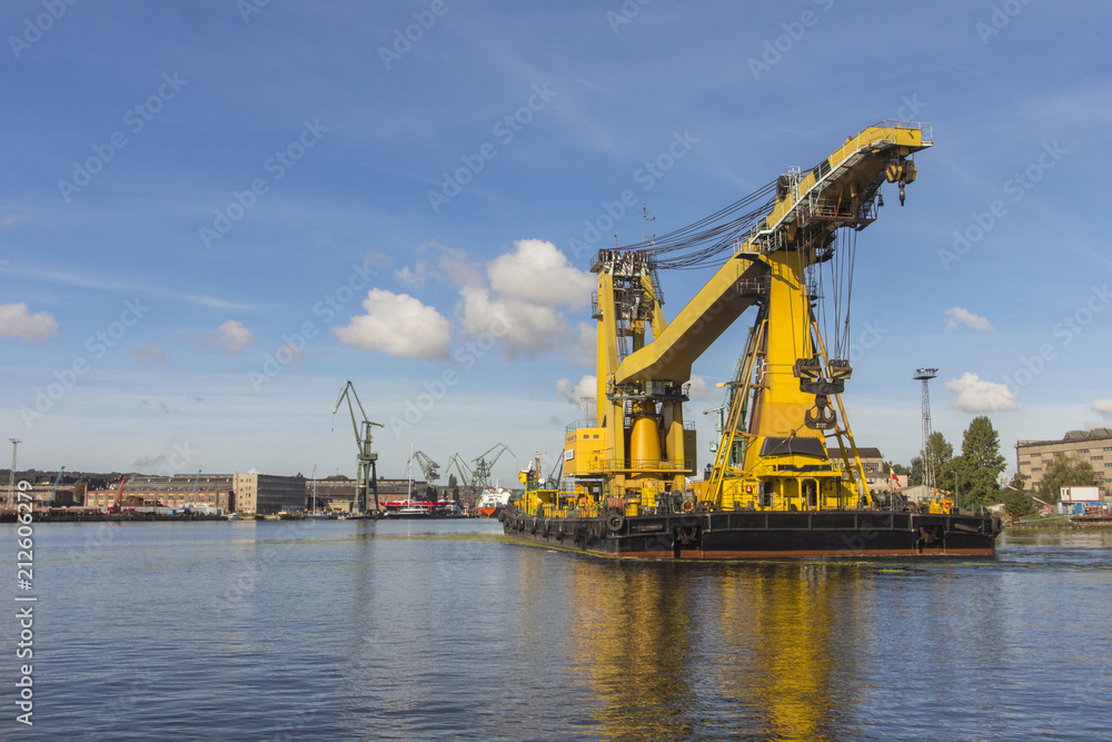 Yellow ship-crane at the seaport of Gdansk. Poland