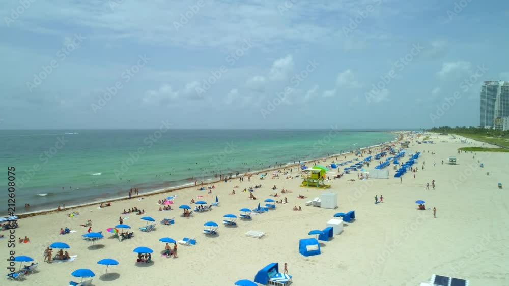 Epic drone shot Miami Beach people on the shore Epic drone shot Miami Beach people on the shore