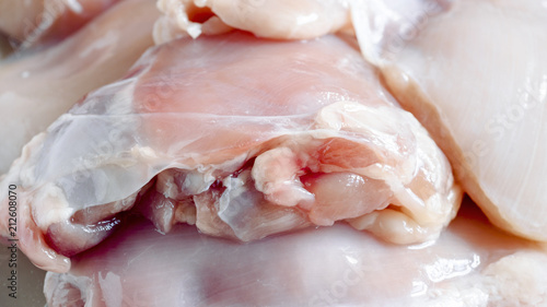 Fresh skinless chicken thighs. Food background. Close up