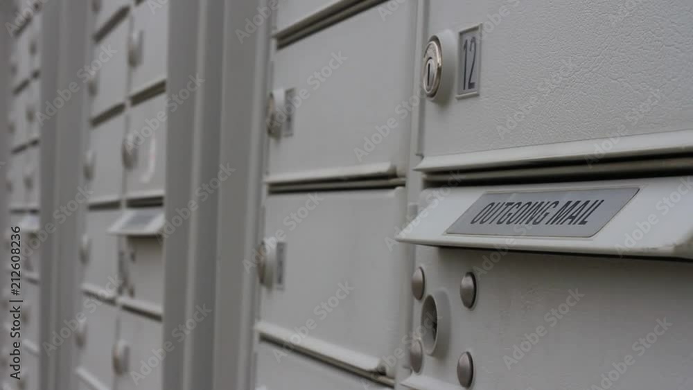 Row of mailbox's with an one for outgoing mail. Row of mailbox's with an one for outgoing mail.