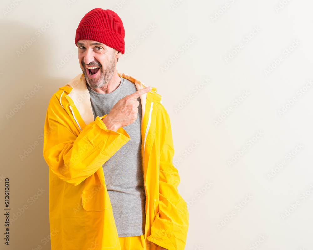 Senior fisherman very happy pointing with hand and finger to the side Senior fisherman very happy pointing with hand and finger to the side