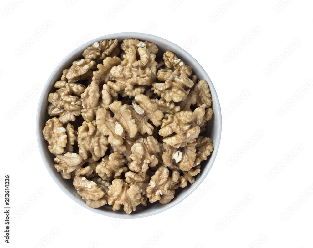 Walnut kernels in a bowl, isolated on white background. Walnut kernels in a bowl, isolated on white background.