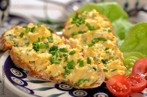Obraz na plátně Healthy breakfast sandwich with  egg paste on wooden background