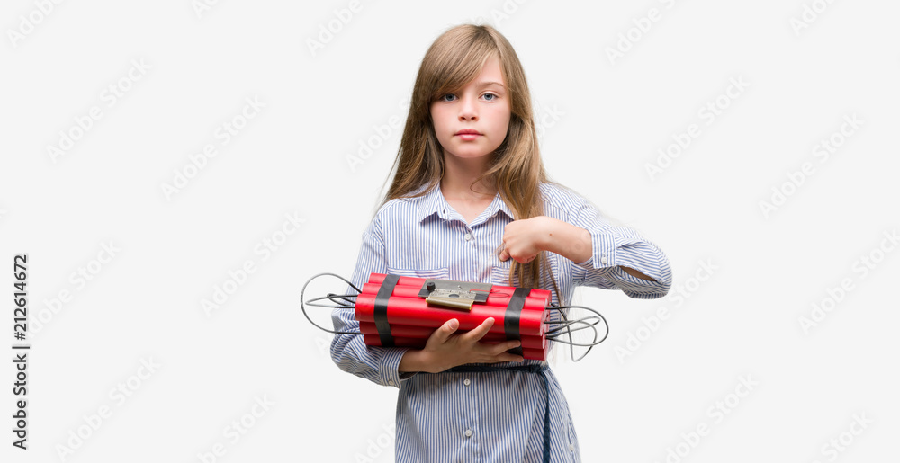 Young blonde child holding dynamite bomb with surprise face pointing finger to himself Young blonde child holding dynamite bomb with surprise face pointing finger to himself