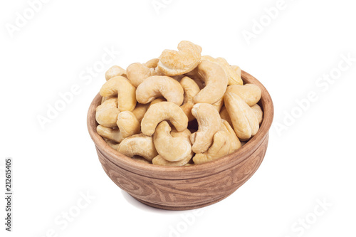 Cashew in brown cup isolated on the white background