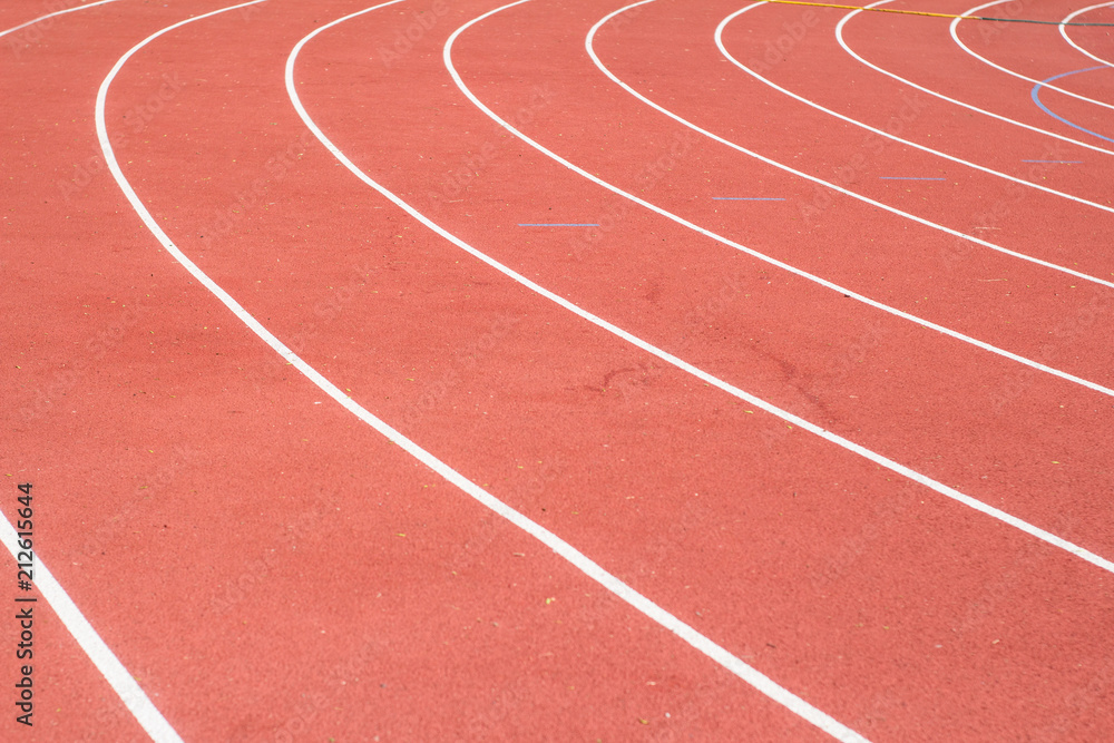 All-weather running track , orange and white lanes for running training