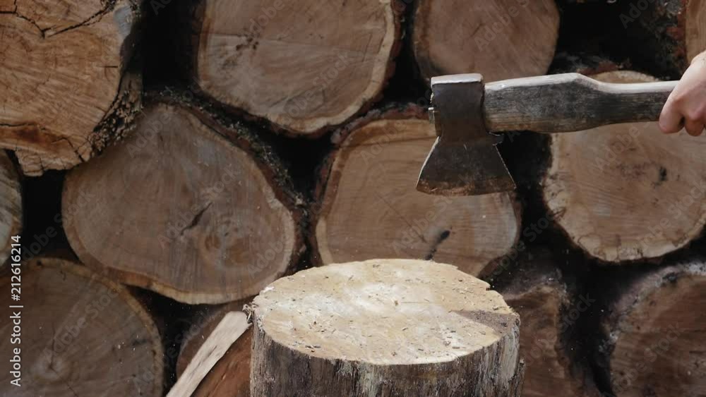 Man hands using ax. Chopping wood slow motion Man hands using ax. Chopping wood slow motion