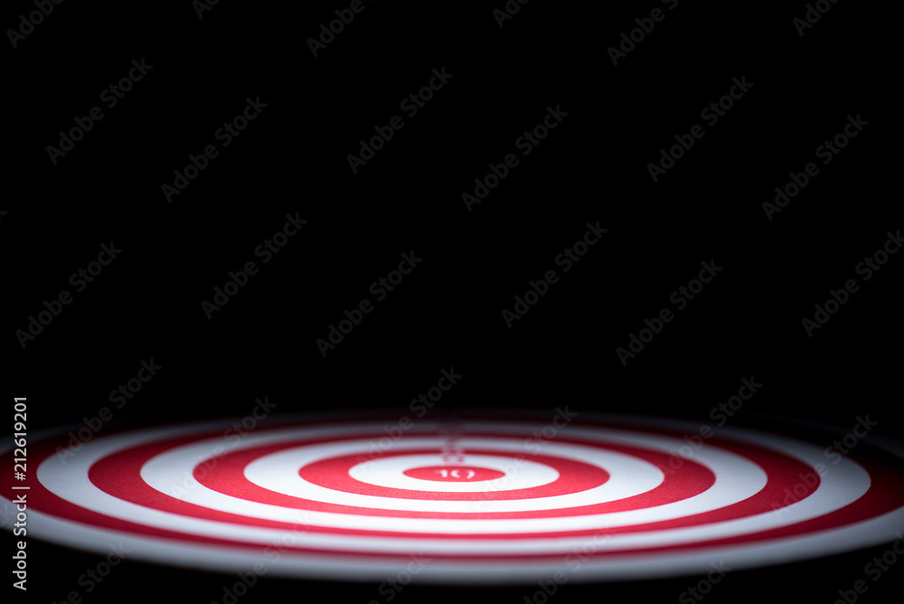 Fototapeta premium abstract dartboard on dark background lighted with snoot