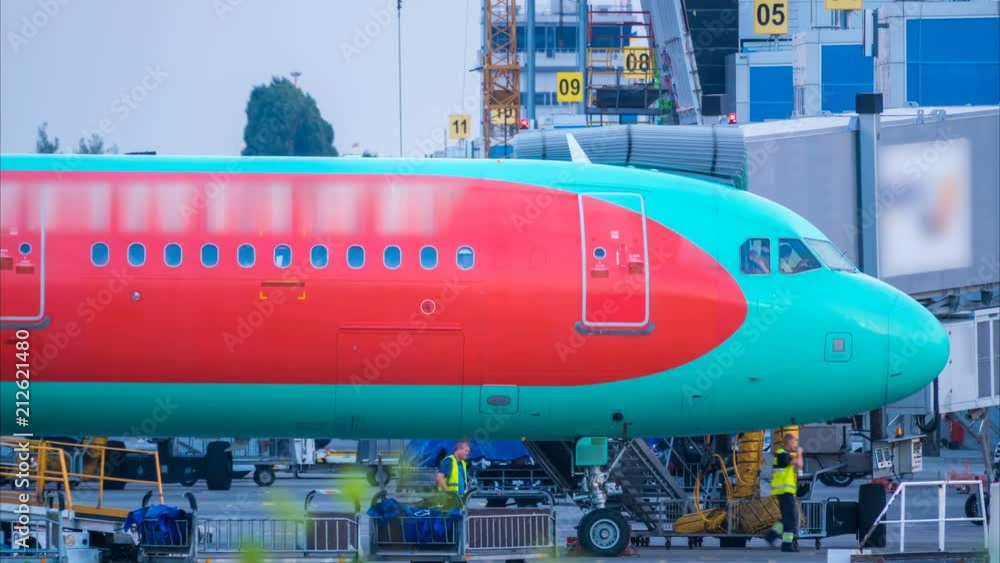 Airport staff servicing just arriving plane. Time lapse. Zoom out effect (All brands and people are unrecognizable) Airport staff servicing just arriving plane. Time lapse. Zoom out effect (All brands and people are unrecognizable)