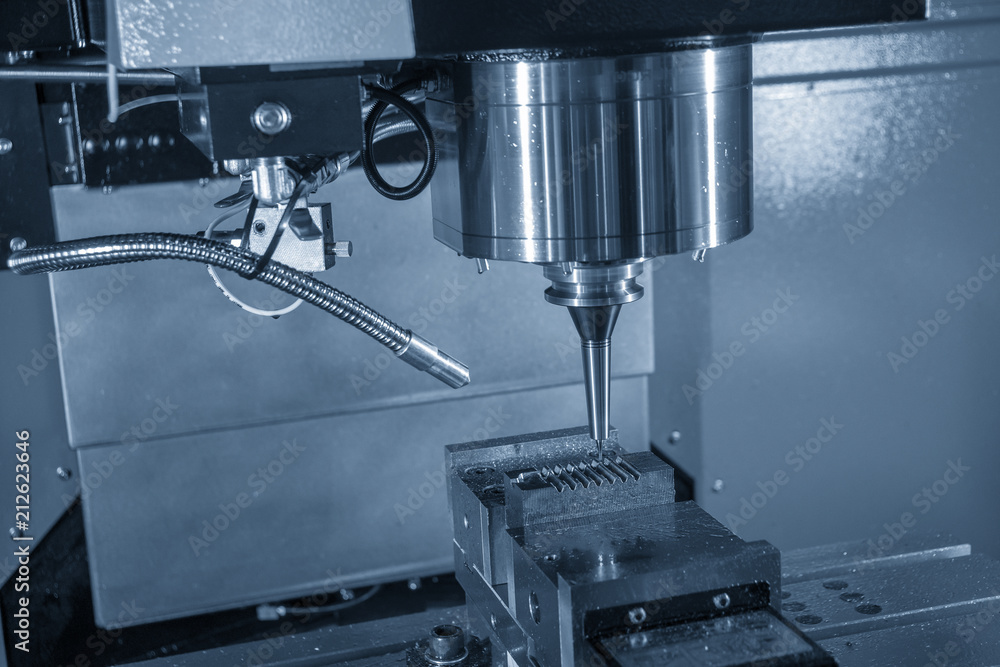 The CNC milling machine cutting the injection mold part with the solid ball endmill tool.The Hi-Technology manufacturing process. The CNC milling machine cutting the injection mold part with the solid ball endmill tool.The Hi-Technology manufacturing process.