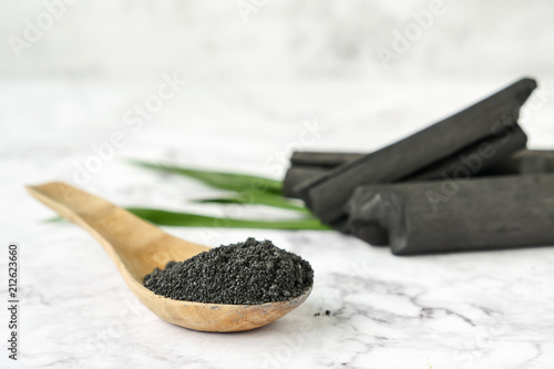 Activated charcoal powder on marble table.