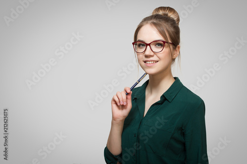 woman in glasses smiles