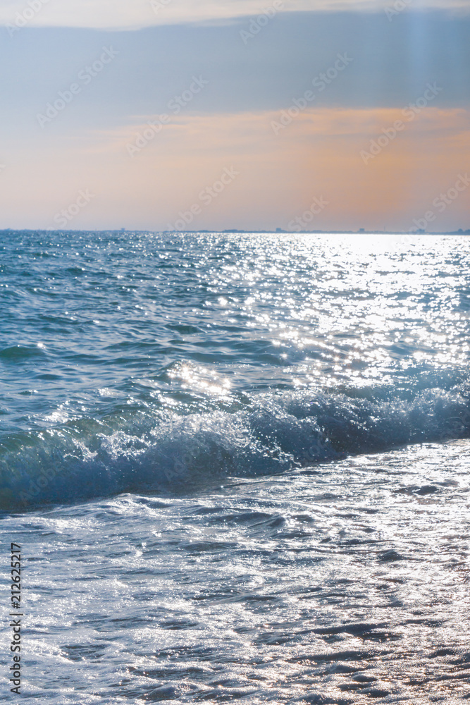 The sea shore at summer Sunny day just before sunset