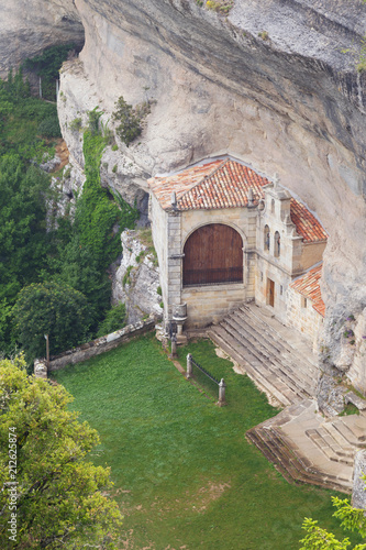 Ancient hermitage and cave of Saint Bernabe, in Ojo Guarena natural park, in Burgos, Castile and Leon, Spain. photo
