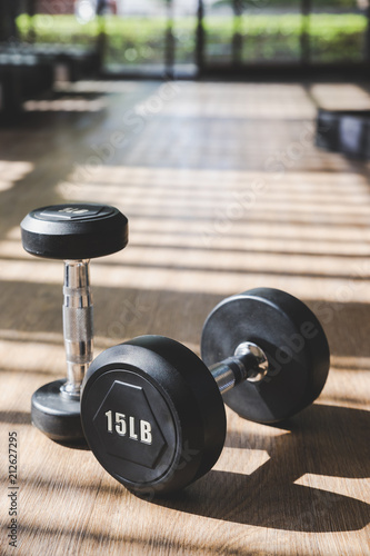 Dumbbell set indoor with hard shadow from large window