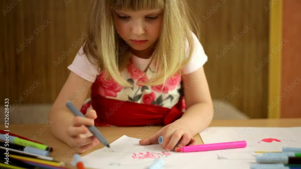 cheerful girl child draws with colored inks cheerful girl child draws with colored inks