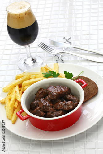 carbonade flamande with frites , flemish beef stew, belgian cuisine photo