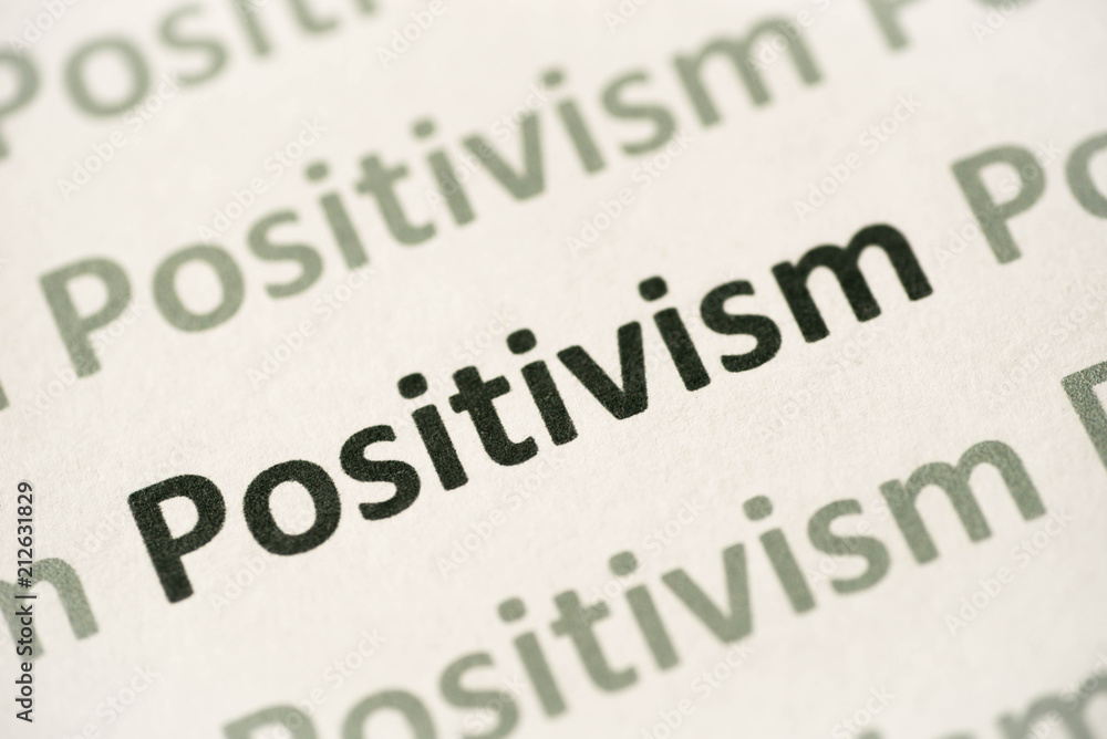 word Positivism printed on paper macro word Positivism printed on paper macro