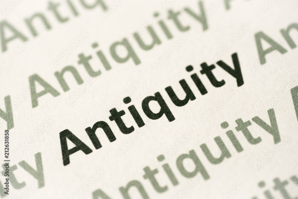 word Antiquity printed on paper macro word Antiquity printed on paper macro