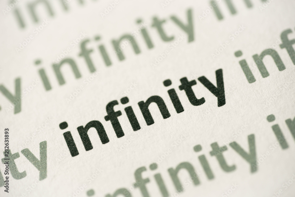 word infinity printed on paper macro