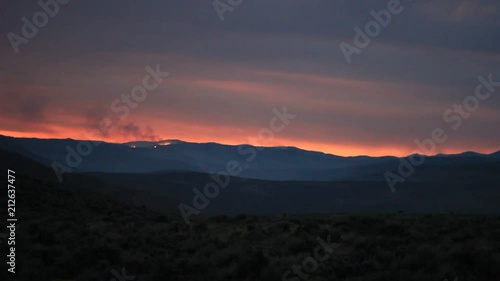 Wallpaper Mural A far off ridge with burning fire and red sunset in the background. Torontodigital.ca
