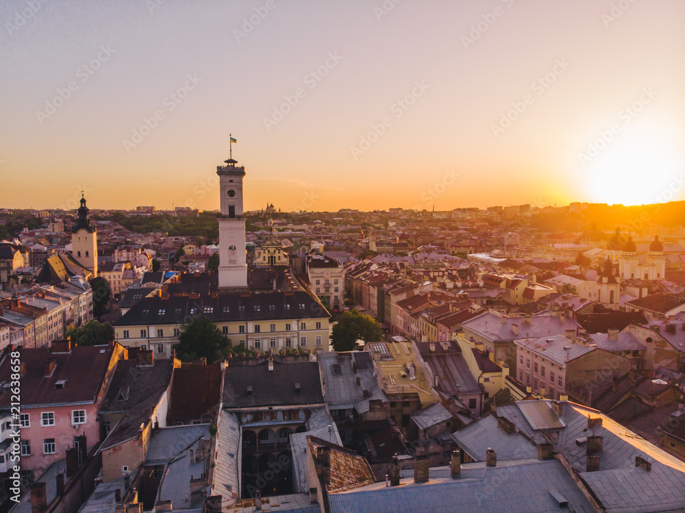 Naklejka premium aerial view of old european city on sunset