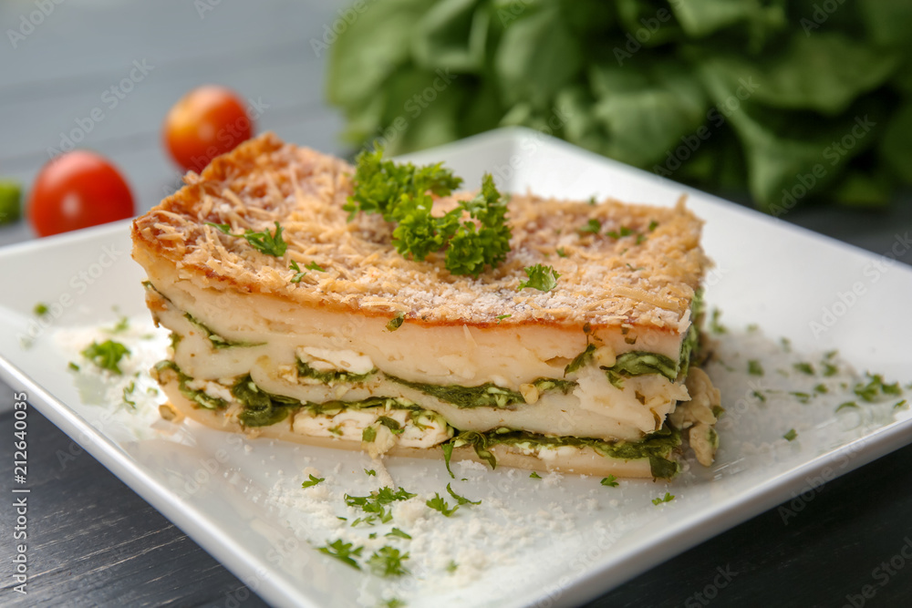 Lasagna with spinach on plate, close up