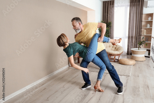 Happy mature couple dancing...