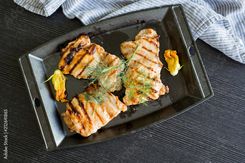 Grilled Chicken in Cast Iron Pan with Squash Blossoms