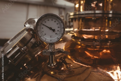 Close up of pressure gauge on storage tank in brewery factory