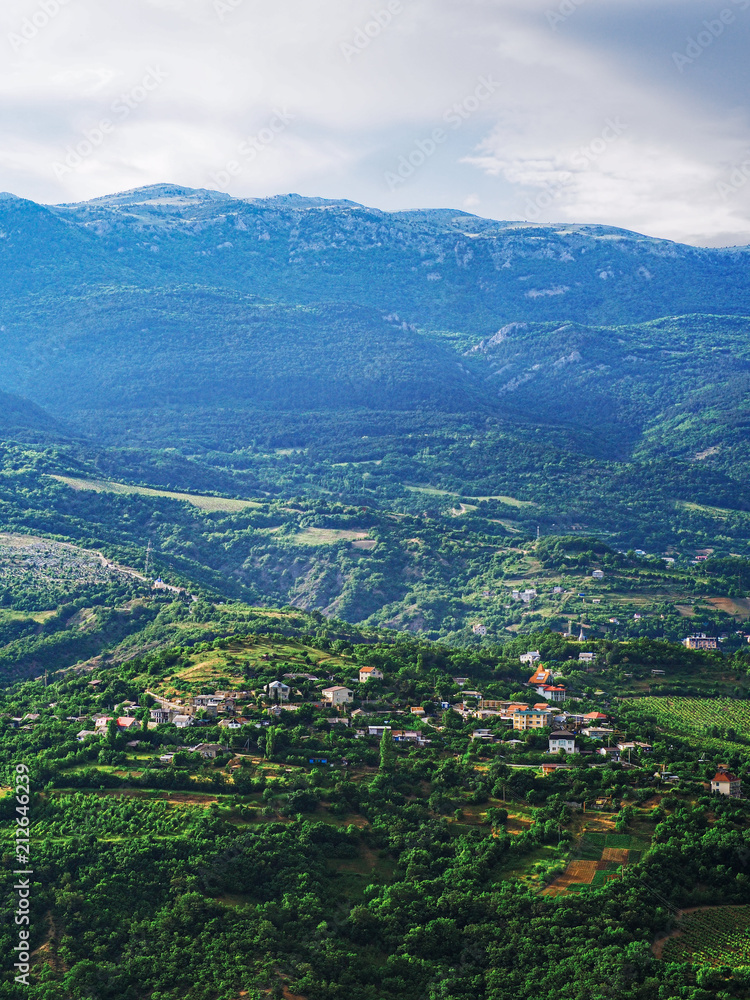 Mountains of the crimea and the green forest and village Mountains of the crimea and the green forest and village