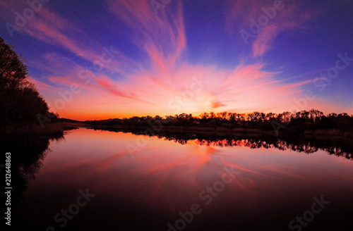 Fototapeta Naklejka Na Ścianę i Meble -  Sunset over the lake at the village