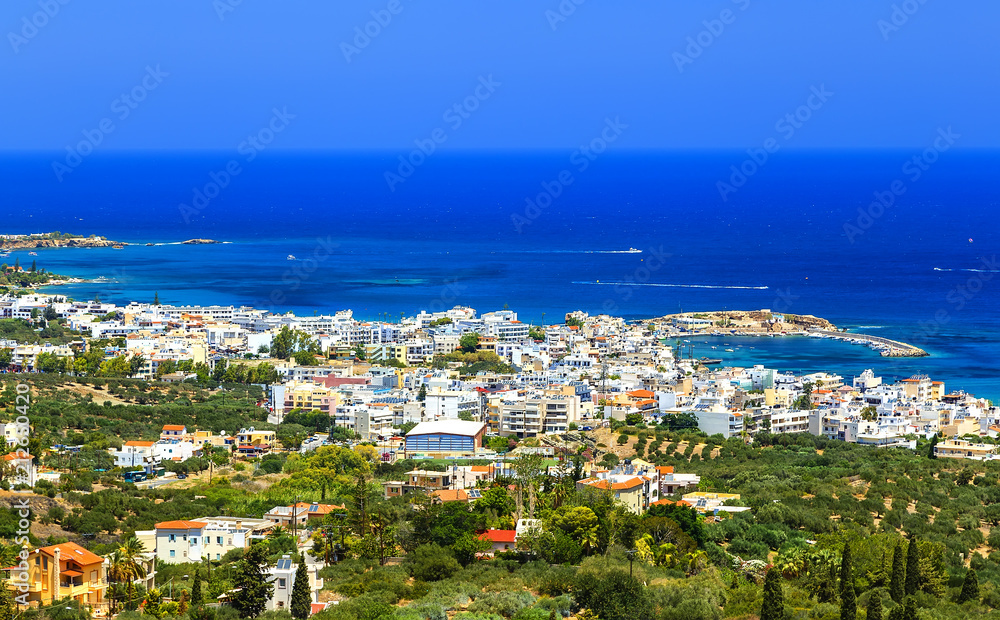 Greek holidays - beautifulcity of Hersonissos, view from the top of mountain with turquoise sea. Crete island