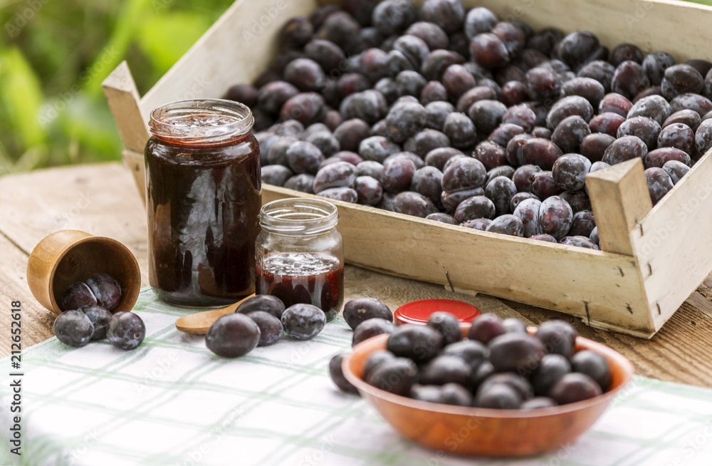 Organic plum fruit products, jar of jam. Plum jam. Organic plum fruit products, jar of jam. Plum jam.