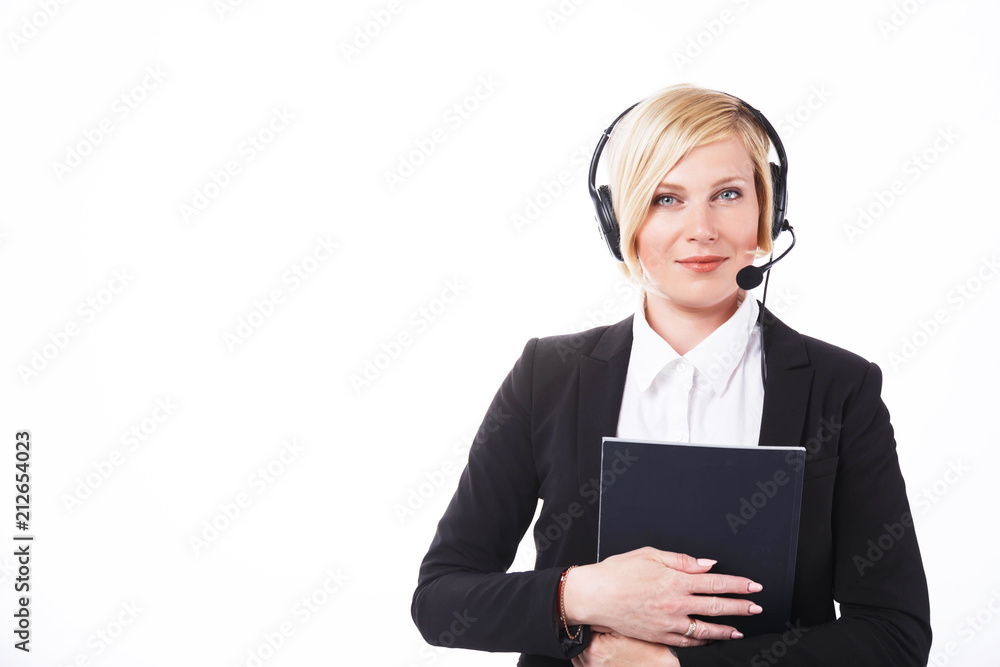 Call center operator, blonde woman dressed in black jacket holding folder before white background with copyspace Call center operator, blonde woman dressed in black jacket holding folder before white background with copyspace