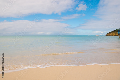 Sea beach in St johns, Antigua. Transparent water at beach with white sand. Idyllic seascape. Discovery and wanderlust. Summer vacation on tropical island with perfect beach. Beach time