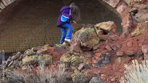 LITTLE GIRL IN AN OLD COKE OVEN photo