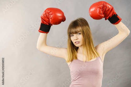 Woman wearing boxing gloves