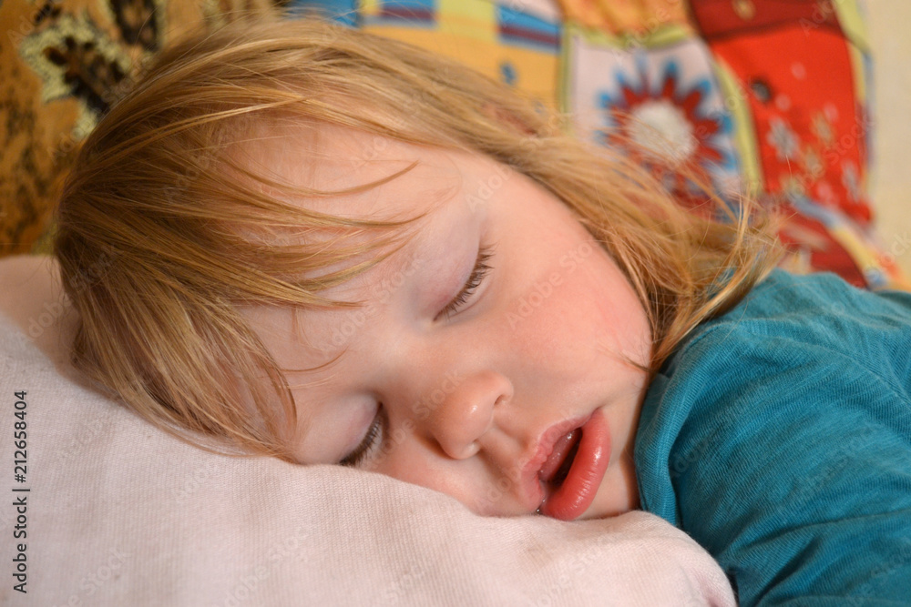cute baby sleeping on a pillow, daytime sleep cute baby sleeping on a pillow, daytime sleep